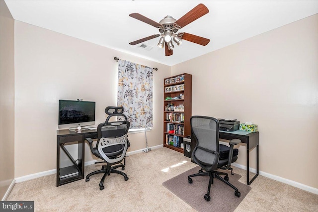 carpeted home office with ceiling fan