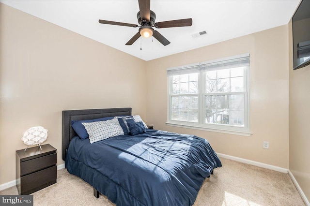 bedroom with ceiling fan and light colored carpet