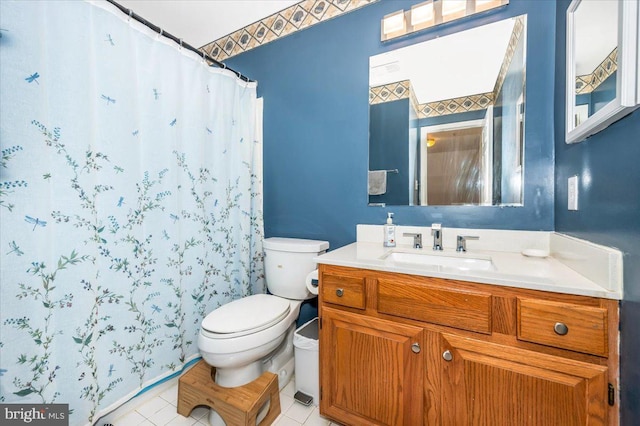 bathroom with tile patterned floors, toilet, a shower with shower curtain, and vanity