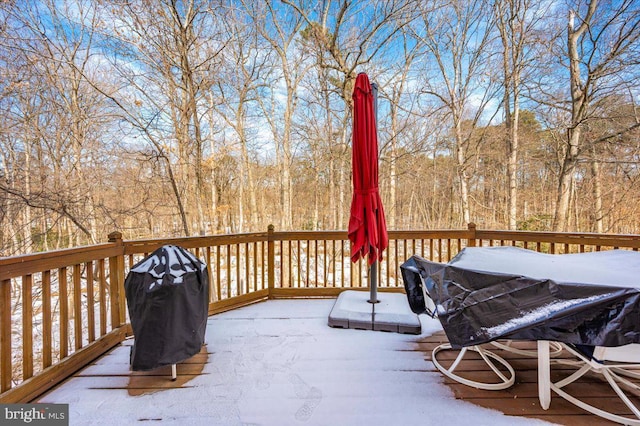 snow covered deck with area for grilling