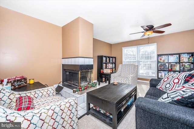 living room featuring ceiling fan and light colored carpet