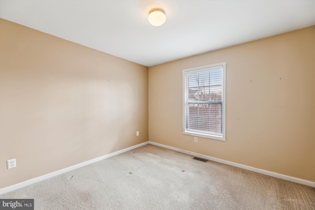 view of carpeted spare room