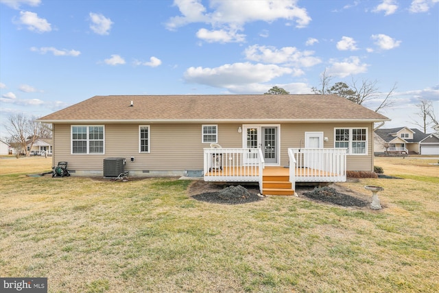 back of house with cooling unit, a yard, and a deck