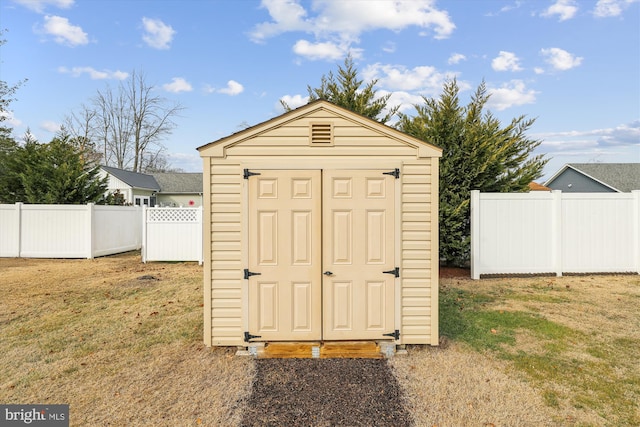 view of outbuilding with a yard