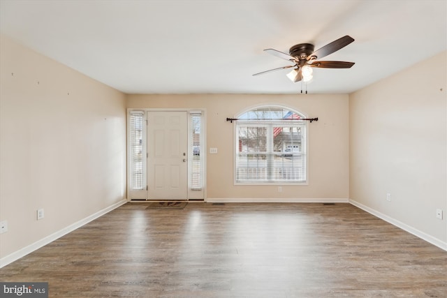 foyer entrance featuring hardwood / wood-style flooring and ceiling fan