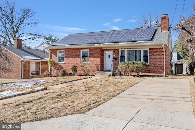 view of front of property with solar panels