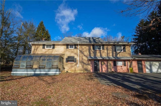 view of front of property featuring a sunroom