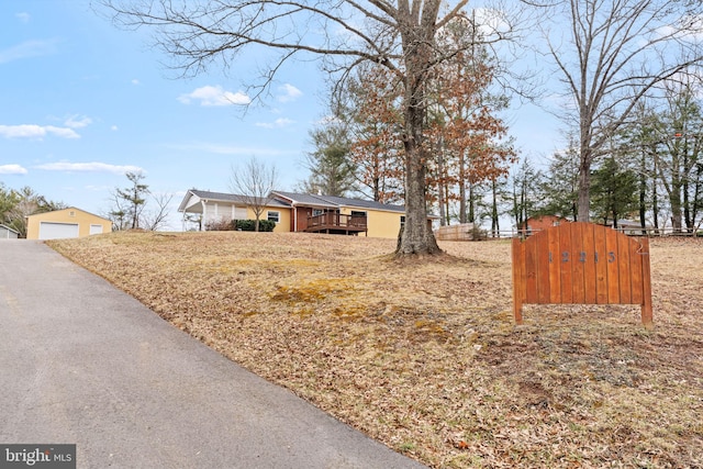 view of front of property with a detached garage