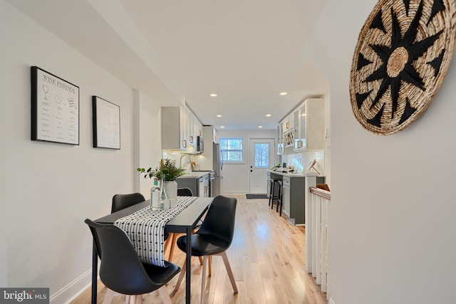 dining room with light wood-type flooring