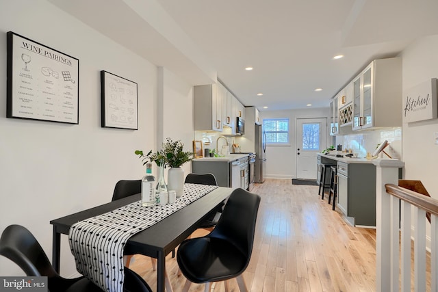 dining area featuring light wood-type flooring