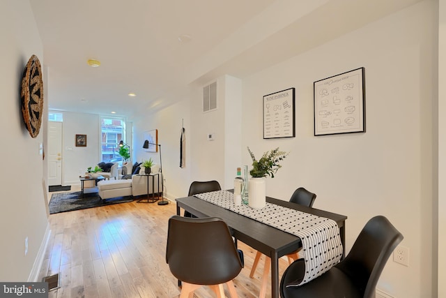 dining room with light hardwood / wood-style flooring