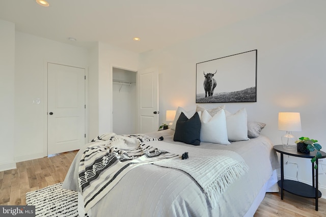 bedroom featuring a closet and light hardwood / wood-style flooring