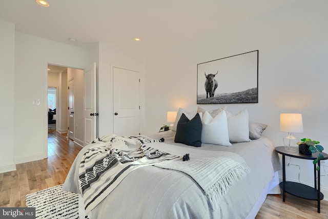 bedroom featuring light wood-type flooring