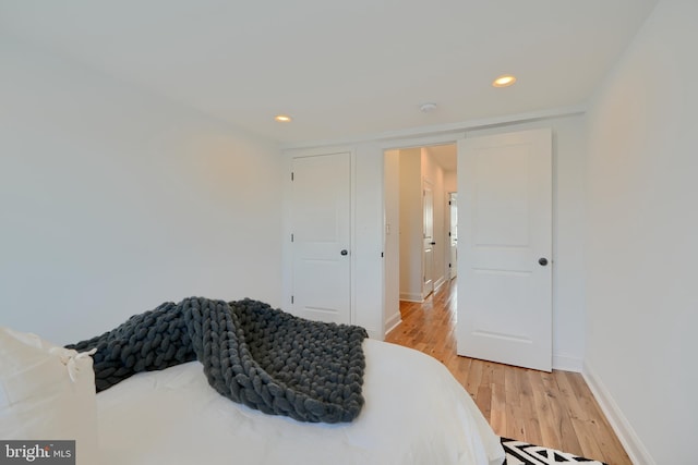 bedroom with light wood-type flooring