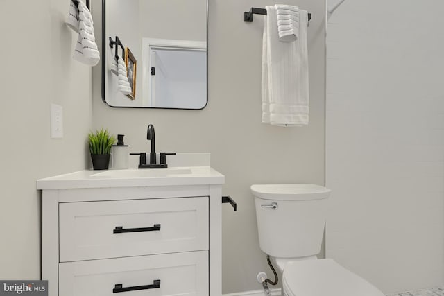 bathroom with vanity and toilet