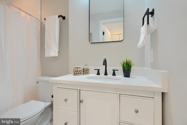 bathroom with vanity and toilet