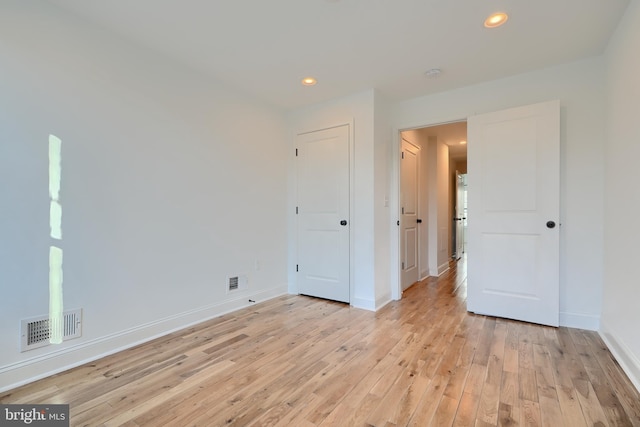 unfurnished bedroom featuring light hardwood / wood-style flooring