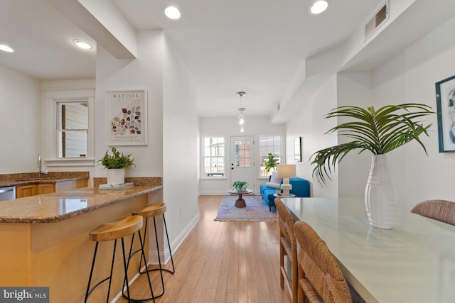 interior space with sink and light wood-type flooring