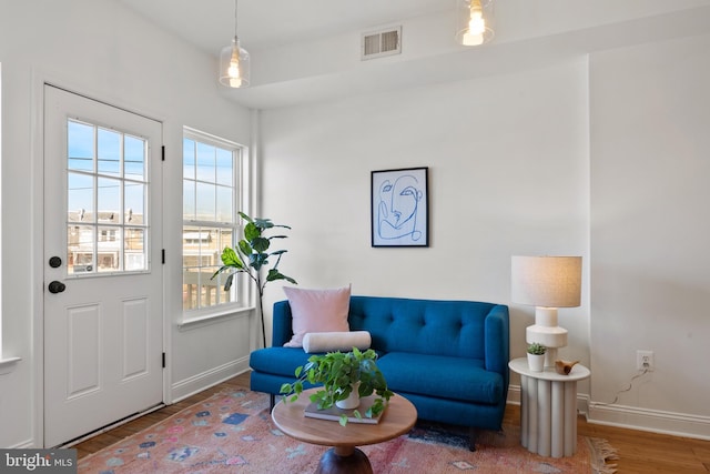 living area with hardwood / wood-style floors