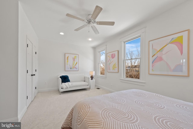 carpeted bedroom featuring ceiling fan