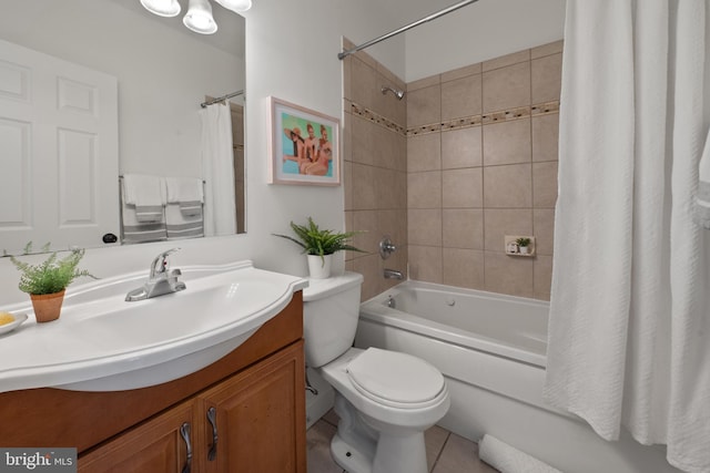 full bathroom with vanity, toilet, tile patterned floors, and shower / tub combo with curtain