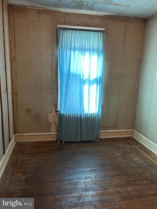 empty room featuring dark hardwood / wood-style floors