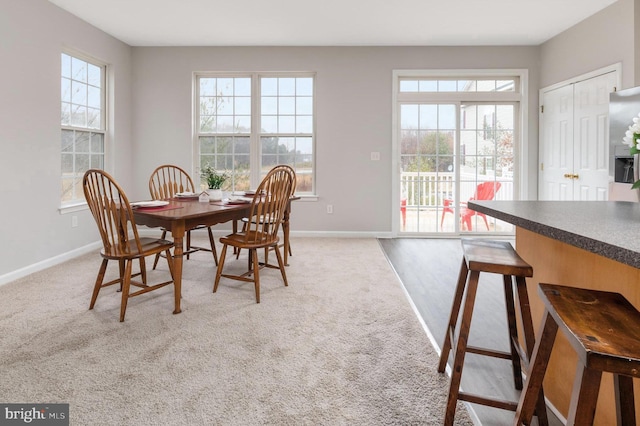 view of carpeted dining space