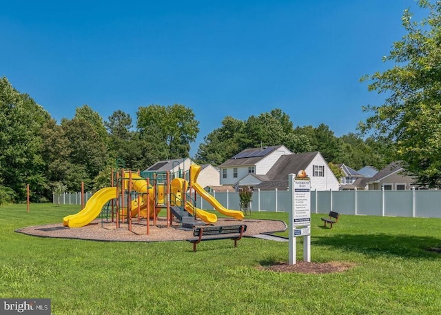 view of play area featuring a lawn