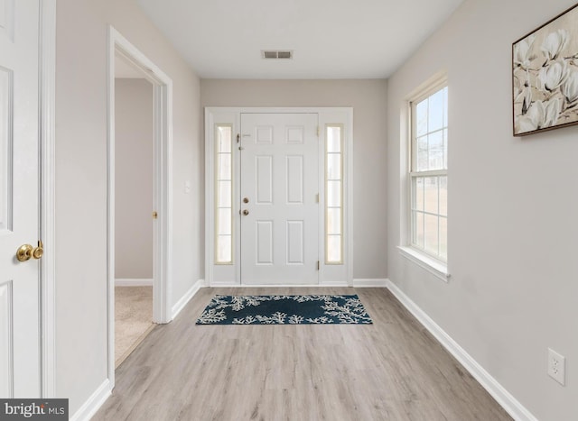 foyer with light wood-type flooring