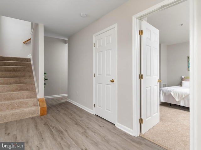 hall with light hardwood / wood-style flooring