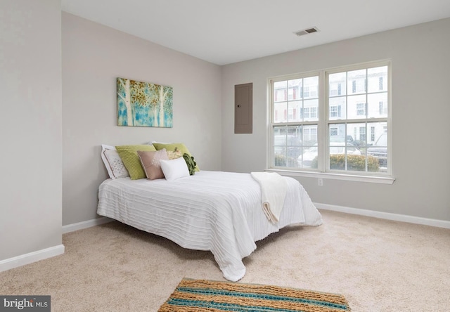 bedroom with carpet flooring and electric panel