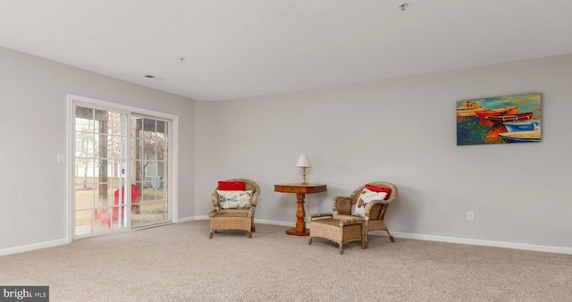 sitting room featuring carpet floors