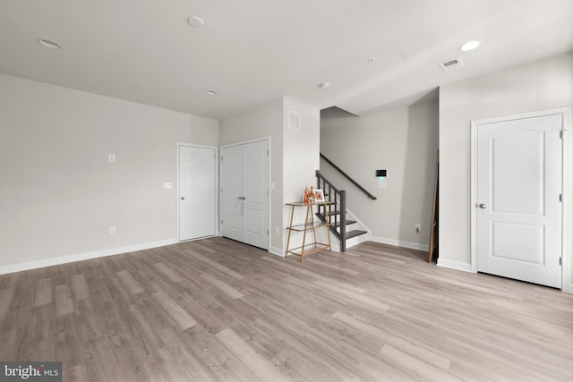 unfurnished room featuring light hardwood / wood-style floors