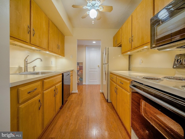 kitchen featuring dishwasher, white refrigerator, light hardwood / wood-style floors, electric stove, and sink