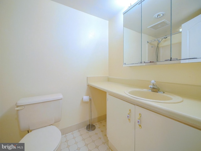 bathroom with toilet and vanity