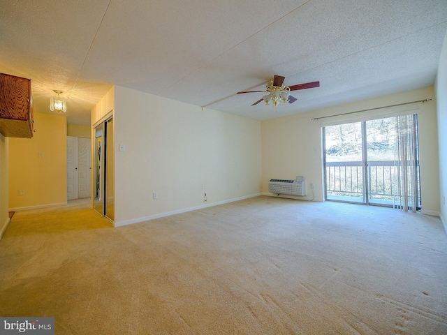 unfurnished room featuring ceiling fan, a textured ceiling, and light carpet