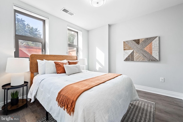 bedroom featuring dark hardwood / wood-style floors