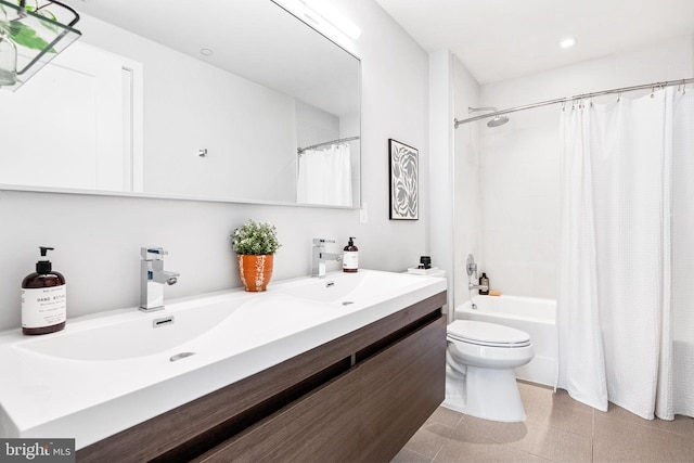 full bathroom with vanity, toilet, and shower / tub combo