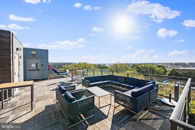 wooden terrace featuring an outdoor living space