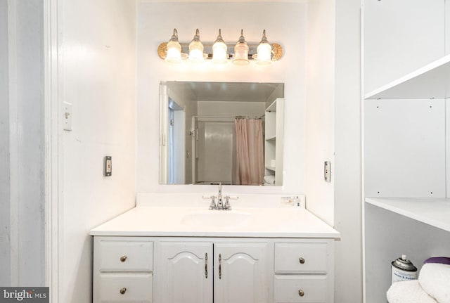 bathroom with vanity and curtained shower