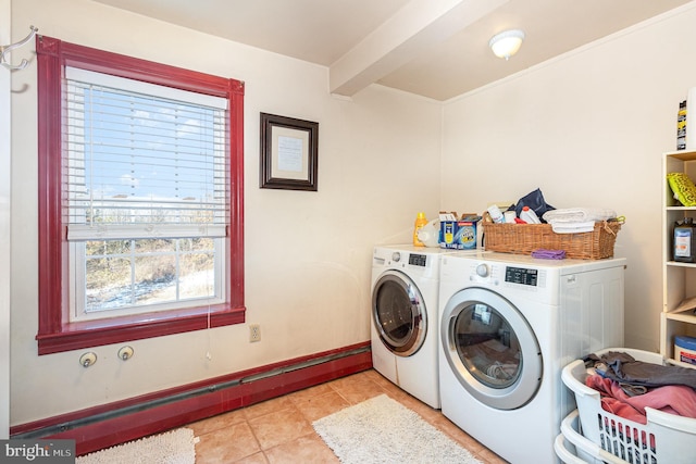 washroom featuring light tile patterned flooring and washer and clothes dryer