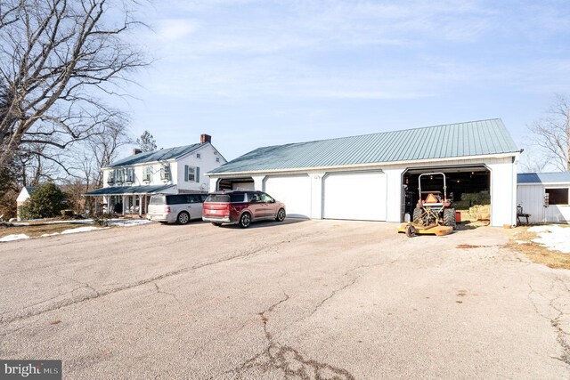 view of front of house featuring an outbuilding and a garage