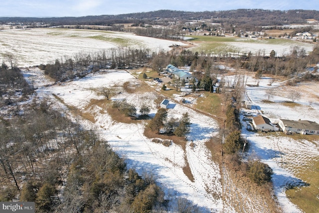 snowy aerial view featuring a rural view