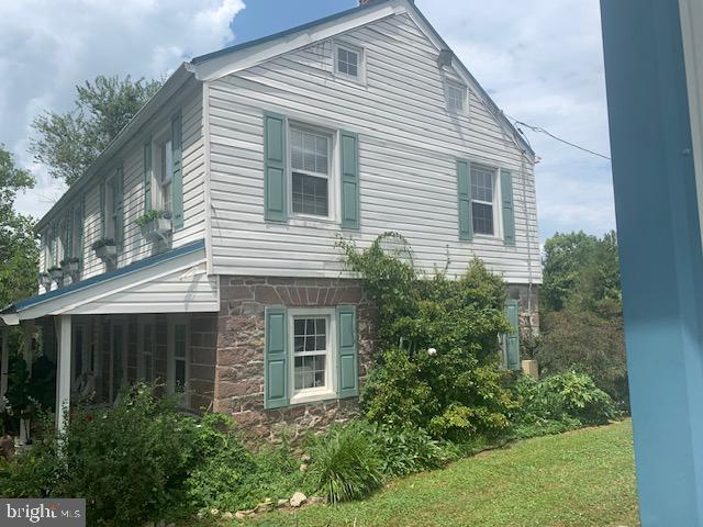 view of home's exterior featuring a yard