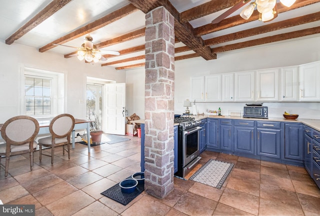 kitchen with stainless steel stove, decorative columns, white cabinets, ceiling fan, and blue cabinetry