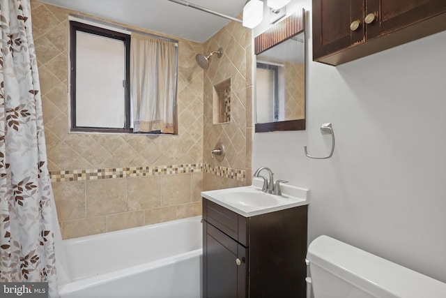 full bathroom featuring vanity, shower / tub combo with curtain, and toilet