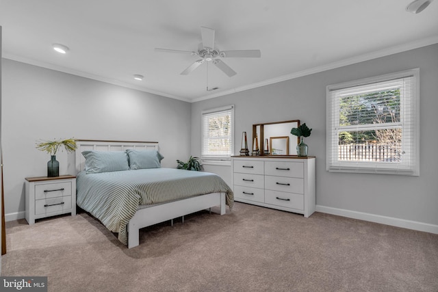 bedroom with multiple windows, ceiling fan, ornamental molding, and light carpet