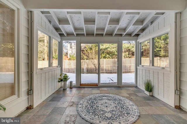 unfurnished sunroom featuring a wealth of natural light