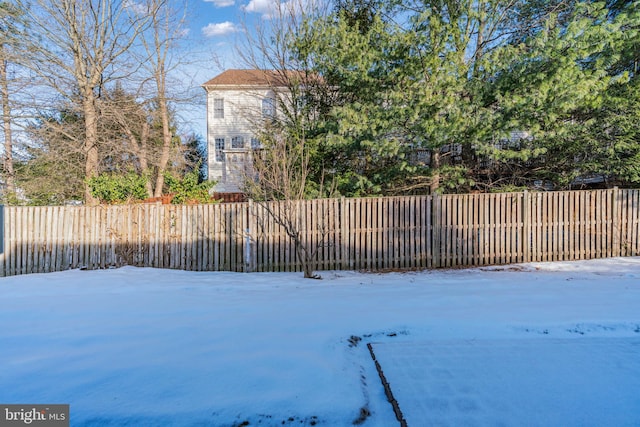 view of yard covered in snow