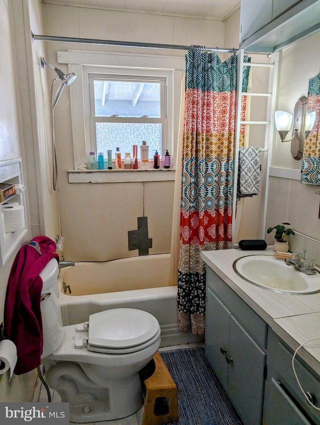 full bathroom with vanity, shower / bathtub combination with curtain, and toilet